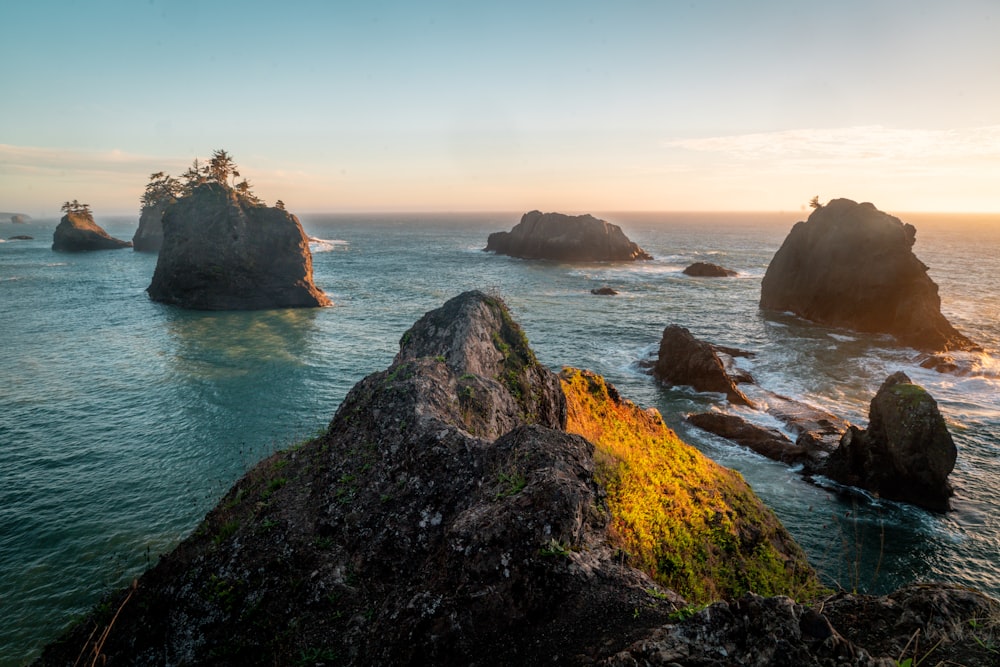 brown rock formation on sea during daytime