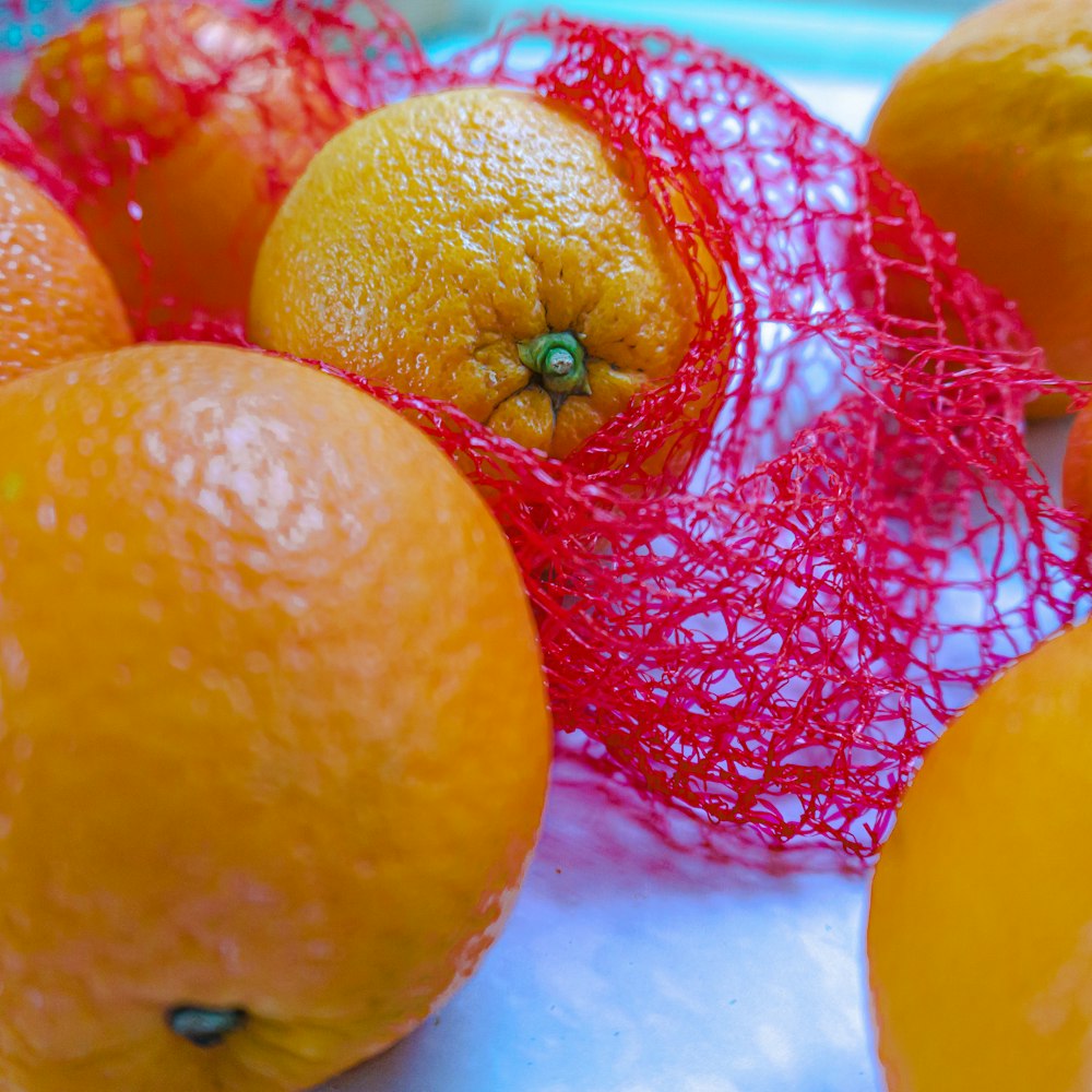 orange fruits on white table