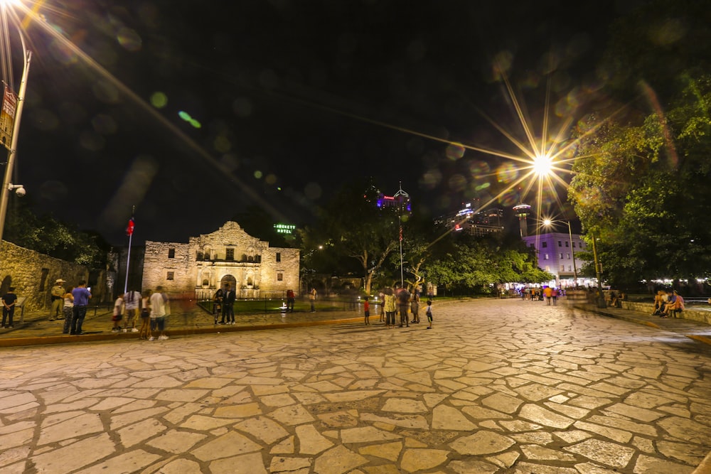 people walking on street during night time