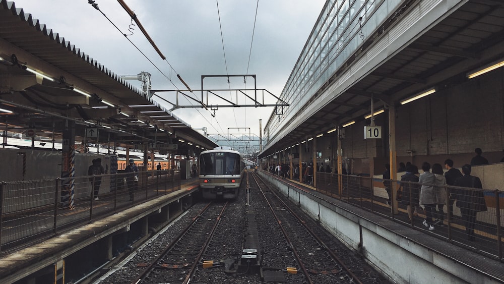 yellow and black train on train station