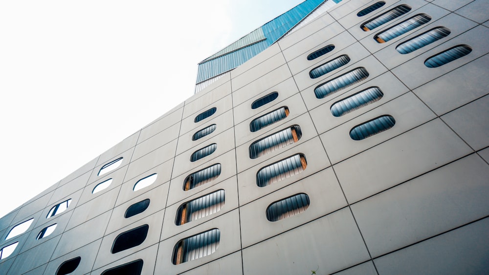 white concrete building with glass windows