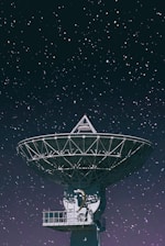 white satellite dish under starry night