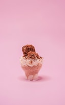 brown ice cream cone on white table
