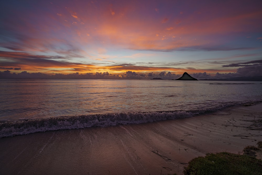 body of water during sunset