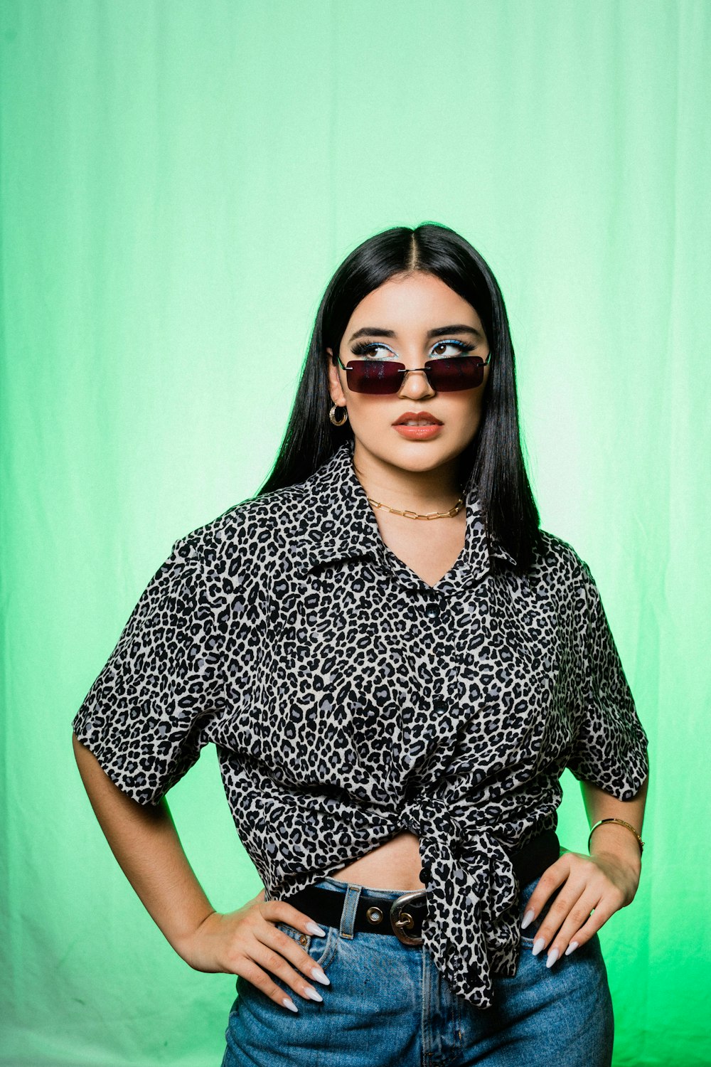 woman in black and white floral shirt wearing black sunglasses