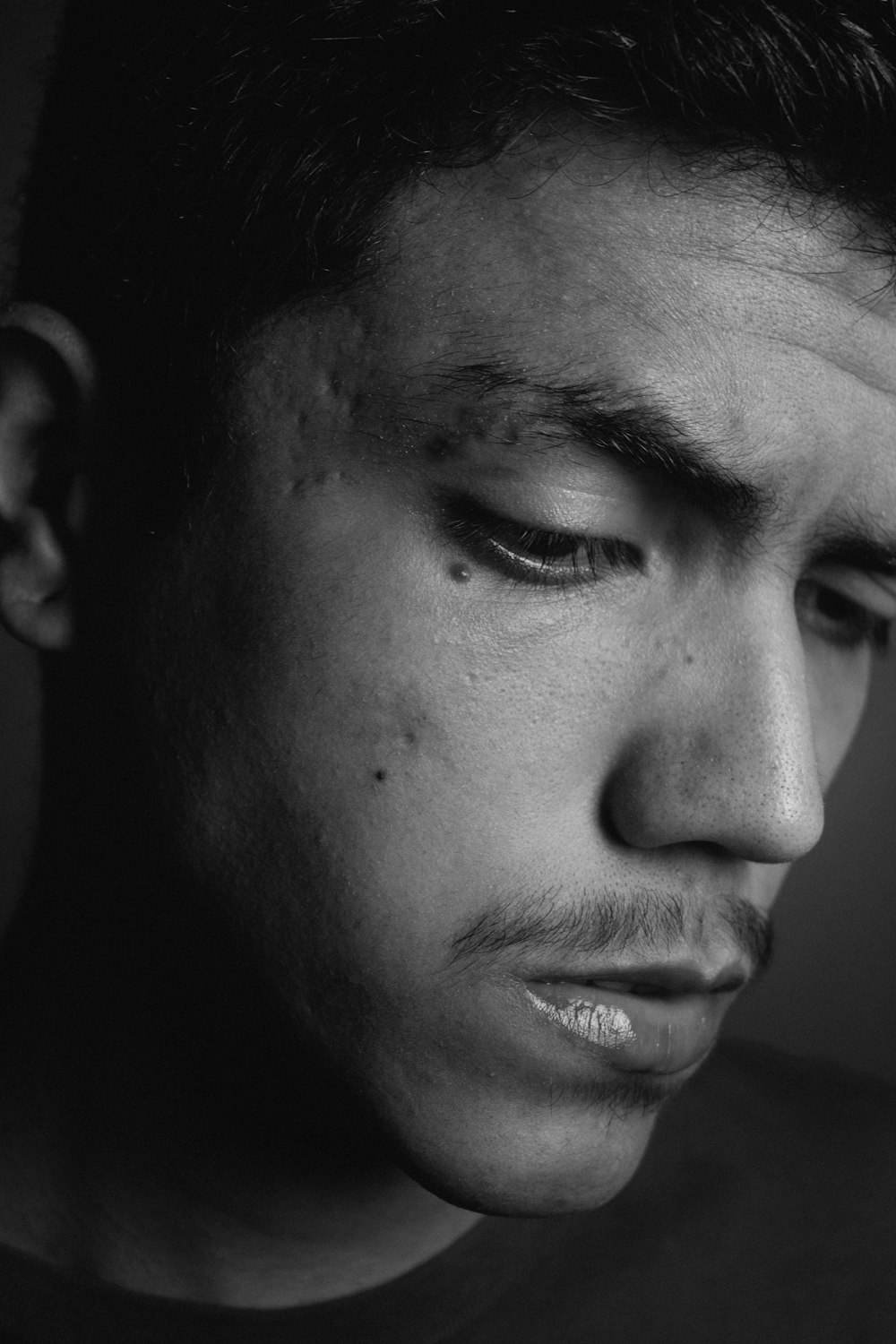 grayscale photo of mans face