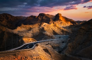 Sunset casting warm orange hues over the Alpine Loop’s winding dirt road.