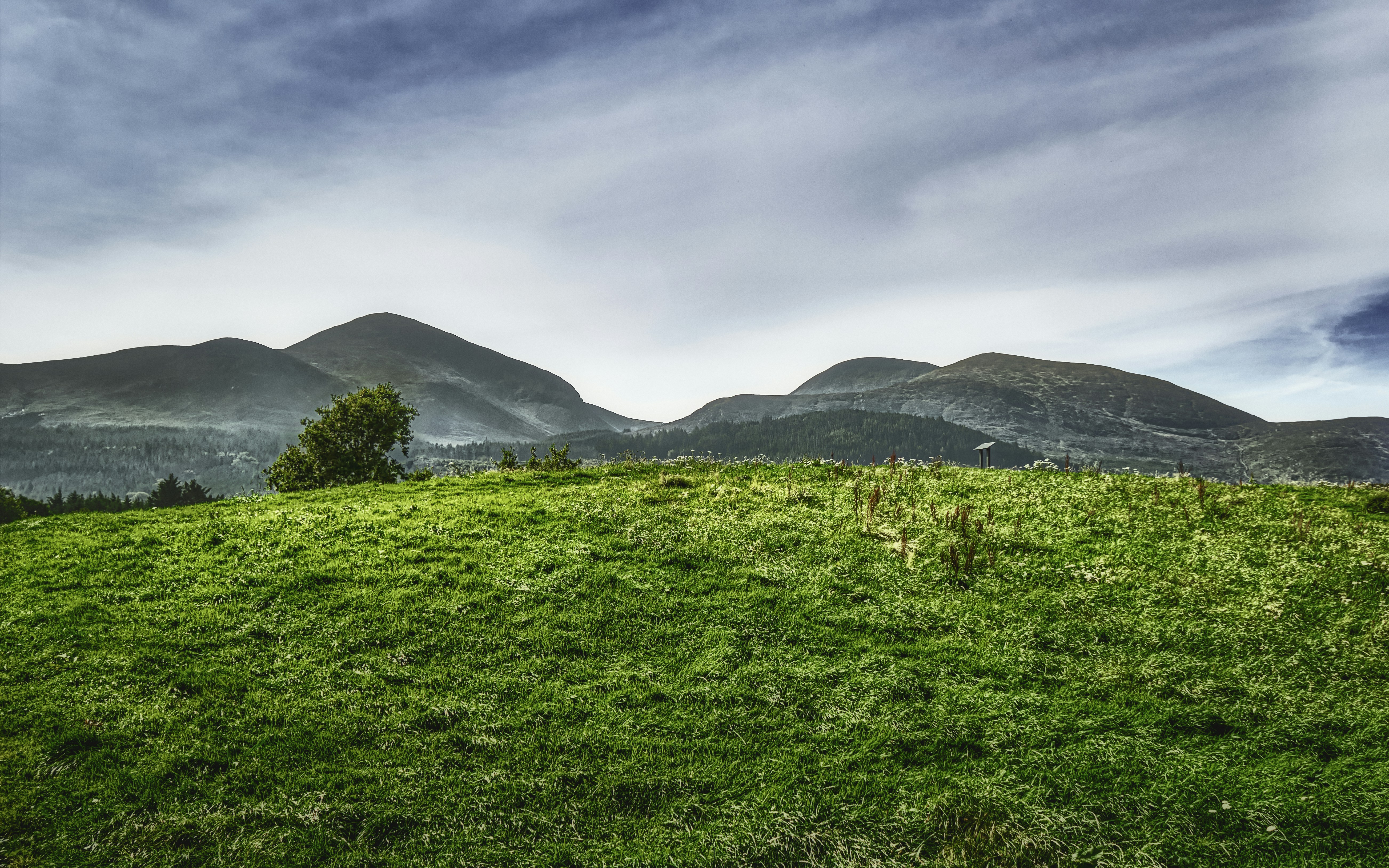 The Mourne Mountains Slieve Donard (right) and Slieve Commedagh (left) meet and form a geological formation known locally as \