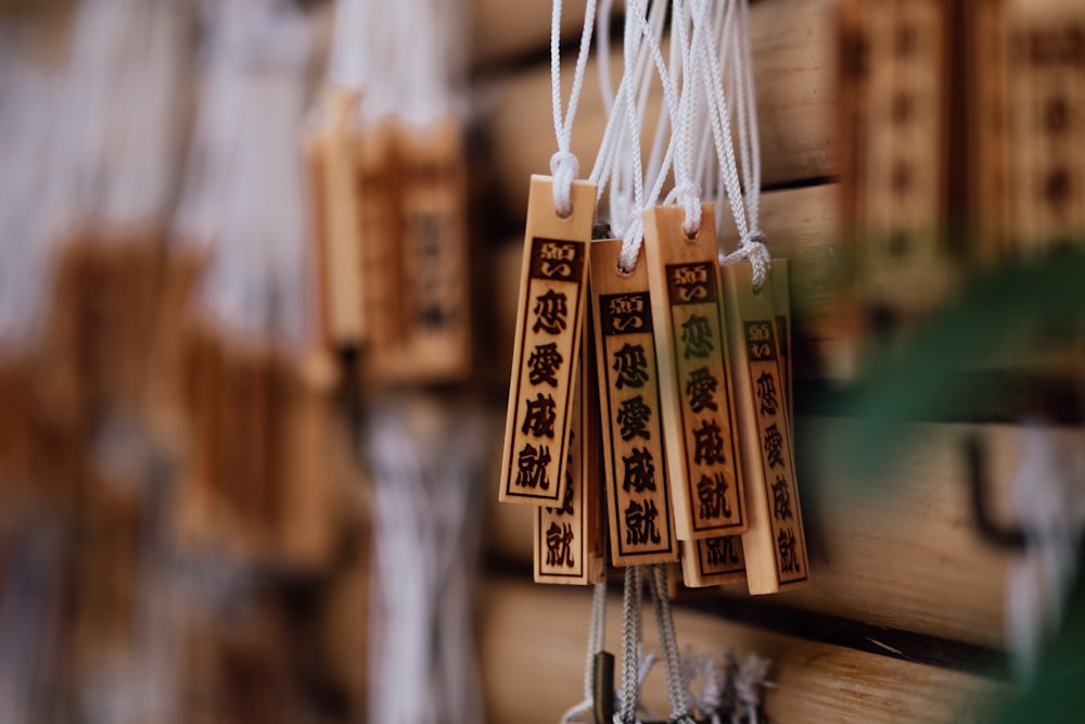 a bunch of tags hanging on a wall