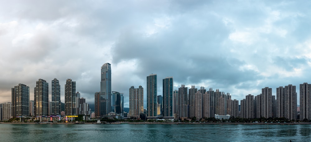 city skyline across body of water during daytime