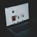 A laptop displaying an Instagram profile page, emitting a soft glow in an otherwise dark environment. The screen shows a grid of images and profile details, including followers and posts.