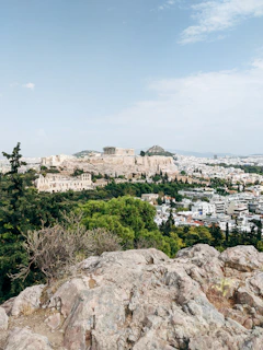 The team arriving joyfully in Athens, with the Acropolis in the background, celebrating the end of their journey.