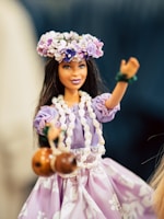 girl in pink dress holding brown egg