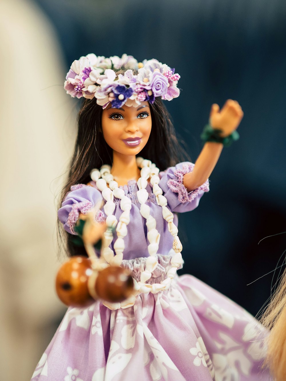 girl in pink dress holding brown egg