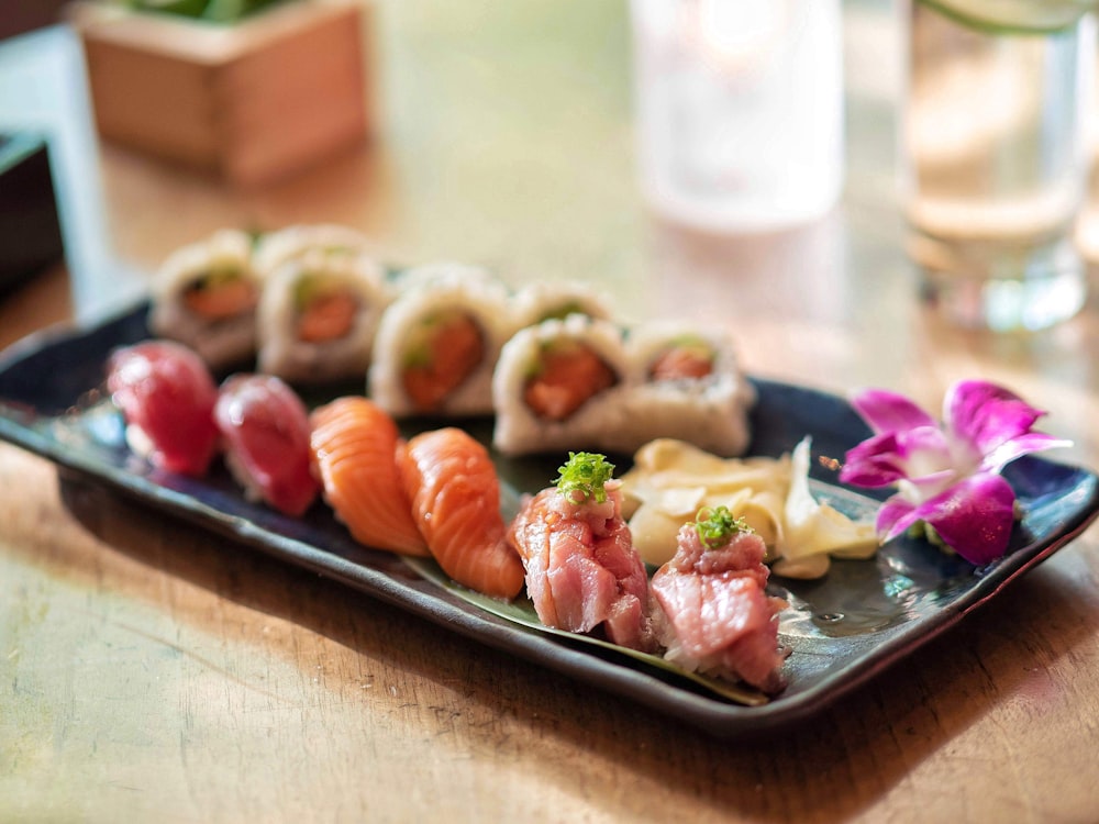 sushi on rectangular white ceramic plate