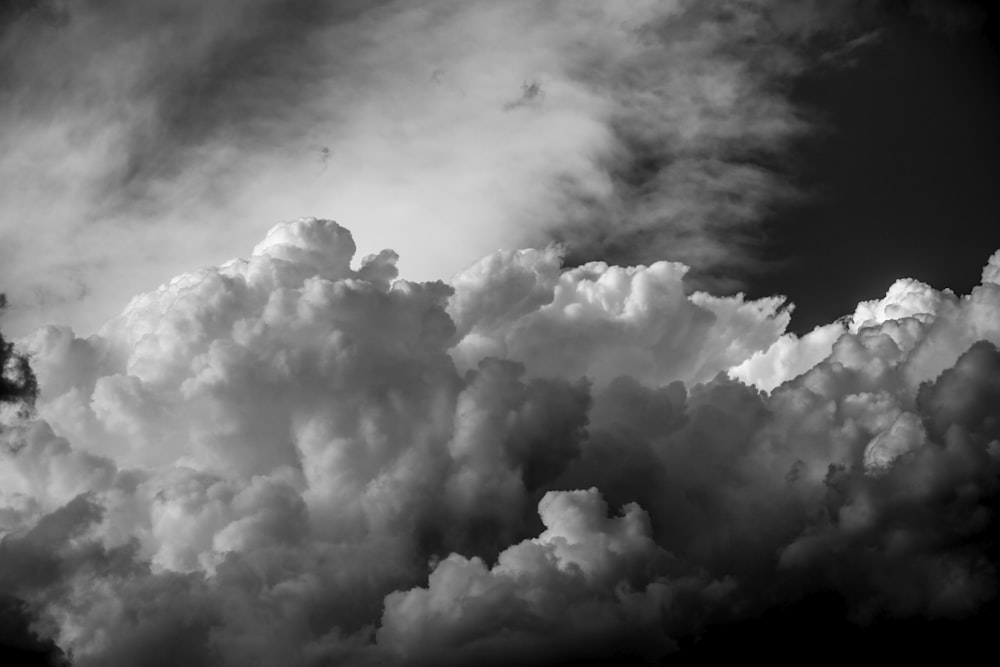 white clouds on black sky