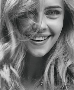 smiling woman in grayscale photography