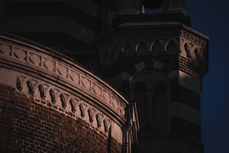 Close-up of a commercial building’s facade showing detailed brickwork.