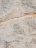 Light gray and white natural stone used in exterior cladding