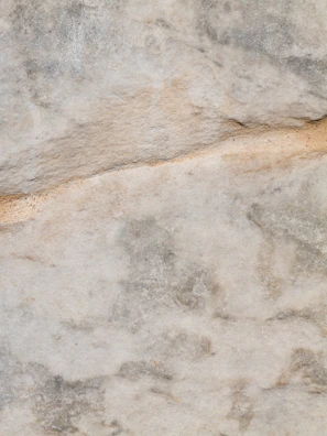 Light gray and white natural stone used in exterior cladding