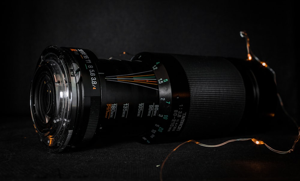 black camera lens on black textile