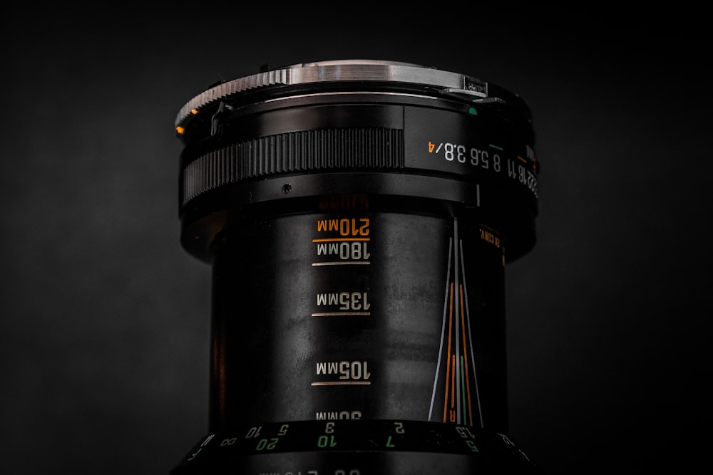 a close up of a camera lens on a black background