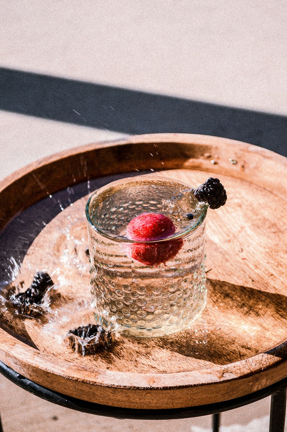 red strawberry in clear glass cup