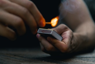 person holding black and white box