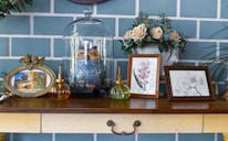An industrial metal console table adorned with decorative items in a modern hallway.