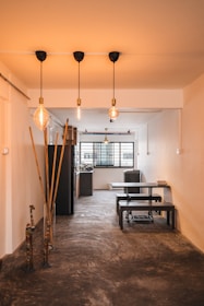 a room that has some lights hanging from the ceiling