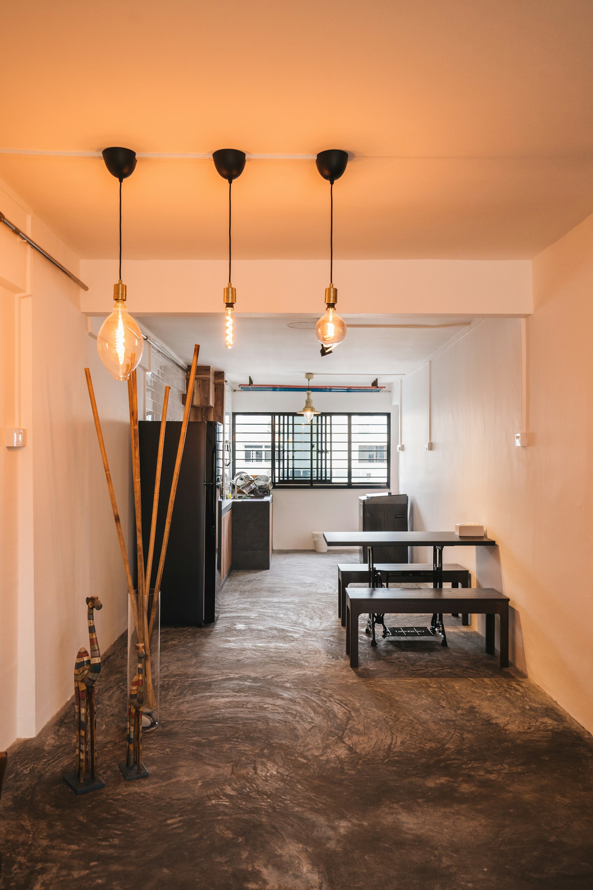 a room that has some lights hanging from the ceiling