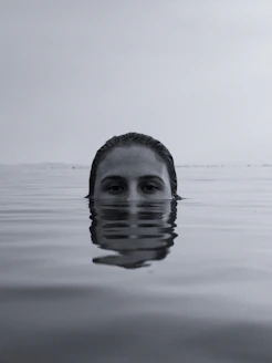 mans face in water