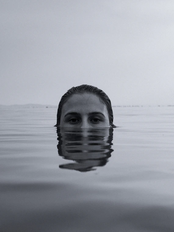 mans face in water