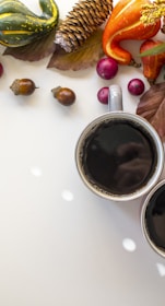 black liquid in white ceramic mug