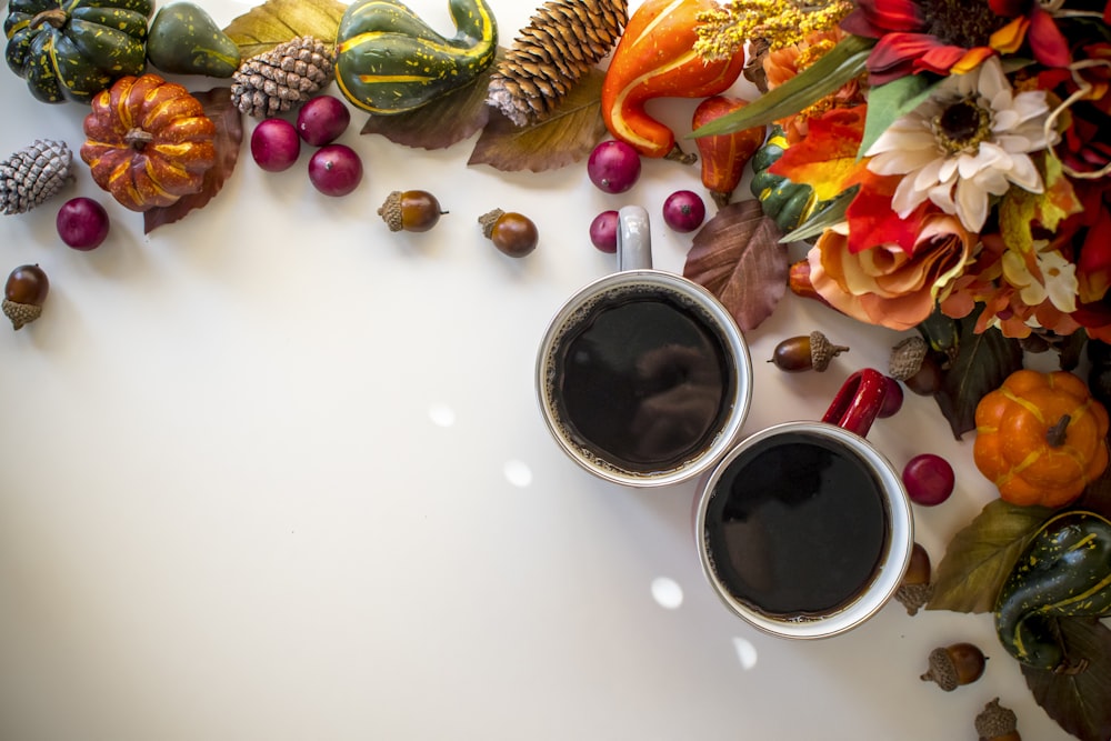 black liquid in white ceramic mug