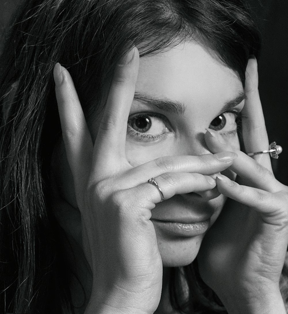 woman with silver ring on her finger