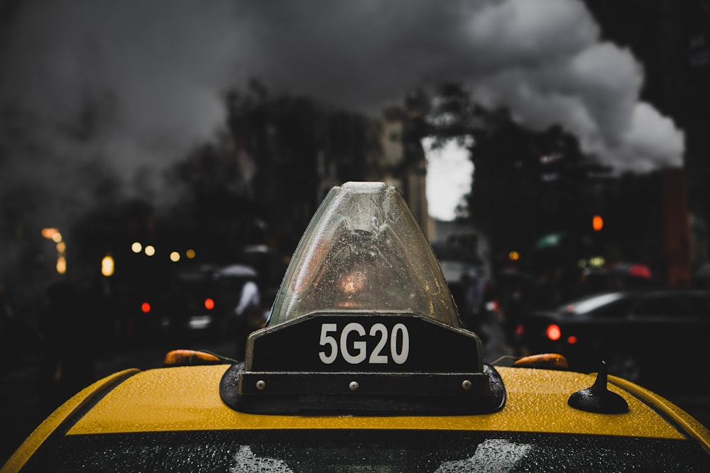 black and yellow car on road during night time