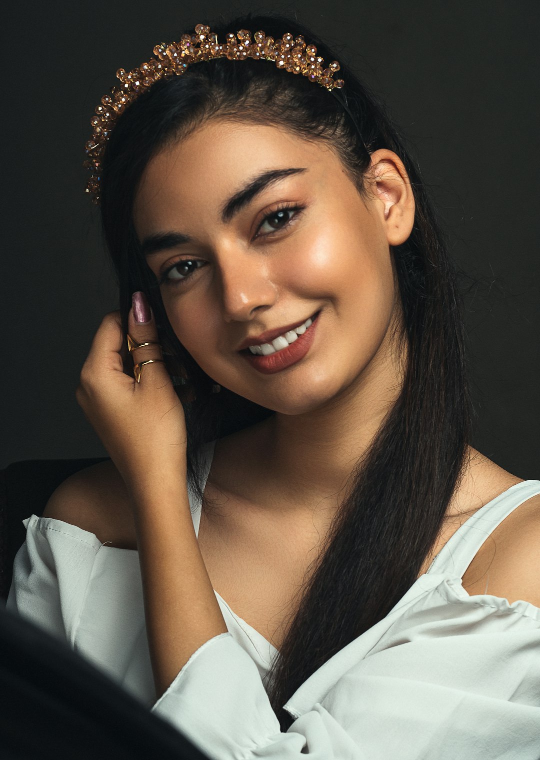 woman in white shirt smiling