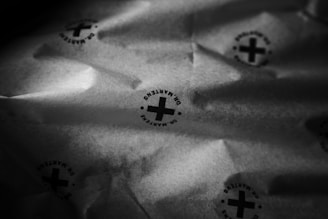 An image displaying the dual-sided nature of the blackout paper, with printing on one side.