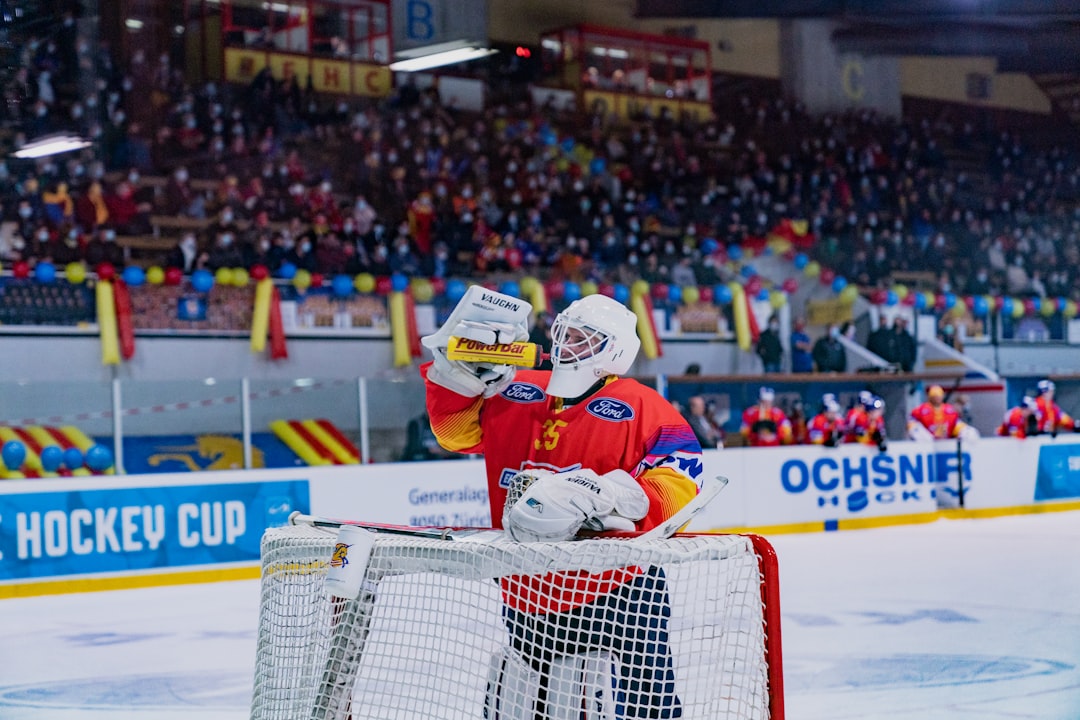 man in white and red jersey shirt wearing white helmet