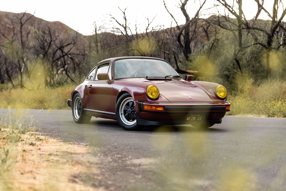 black porsche 911 on road during daytime