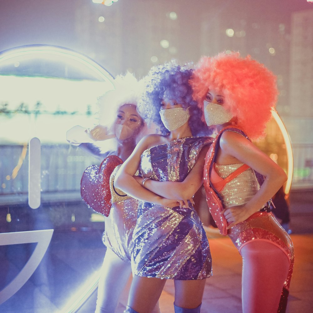 2 women in blue and white floral dress dancing