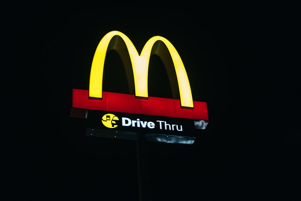 red and yellow love neon light signage