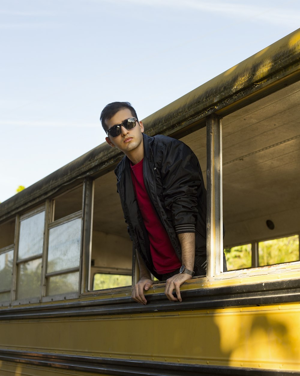 man in black jacket wearing black sunglasses