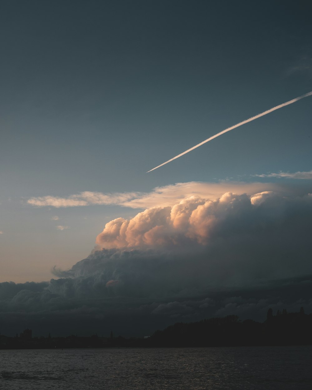 white clouds over brown mountain