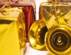 Festive seasonal gift boxes wrapped in bright paper with ribbons, ready to delight.