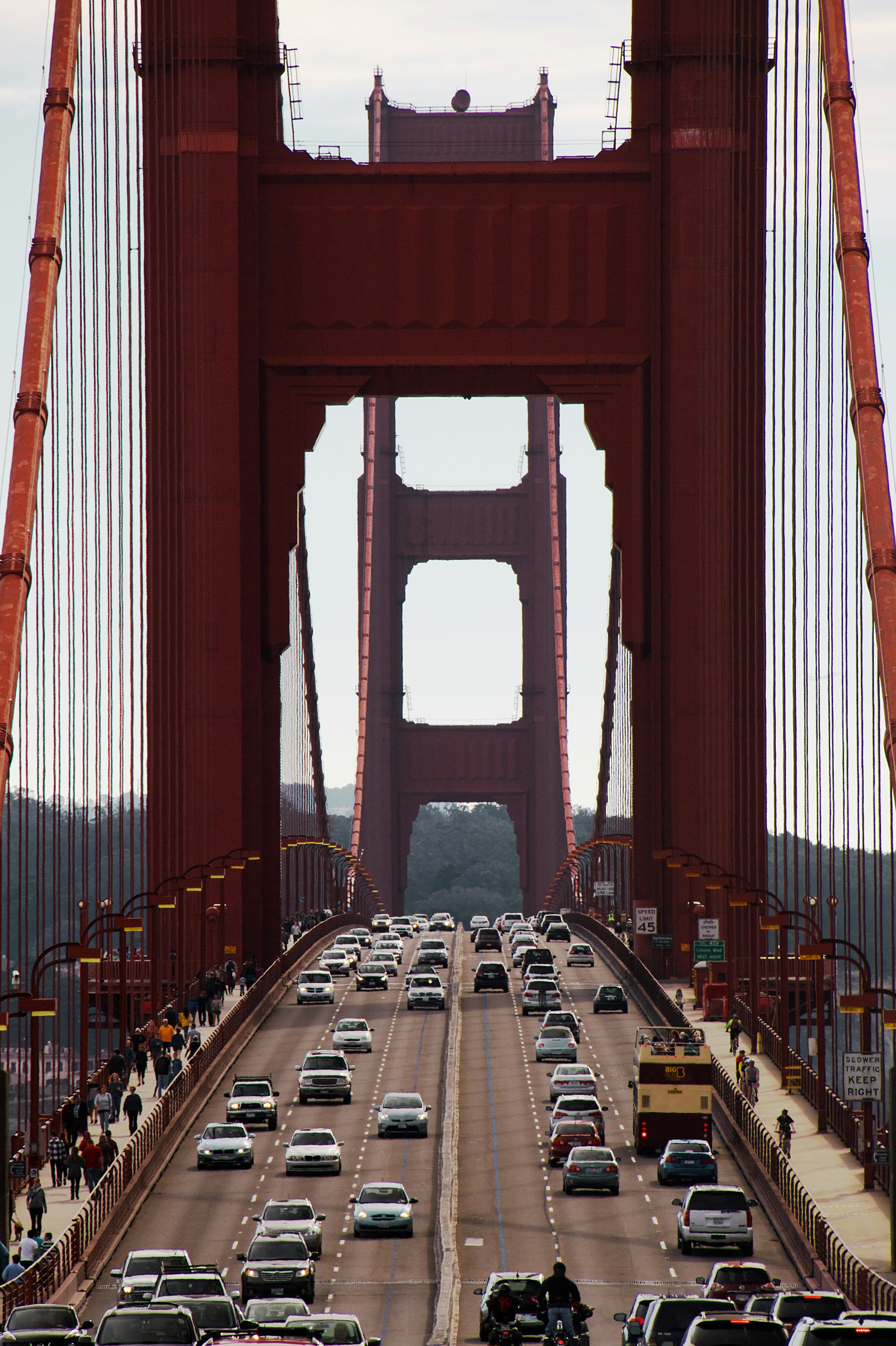 red-bridge-over-body-of-water-during-daytime