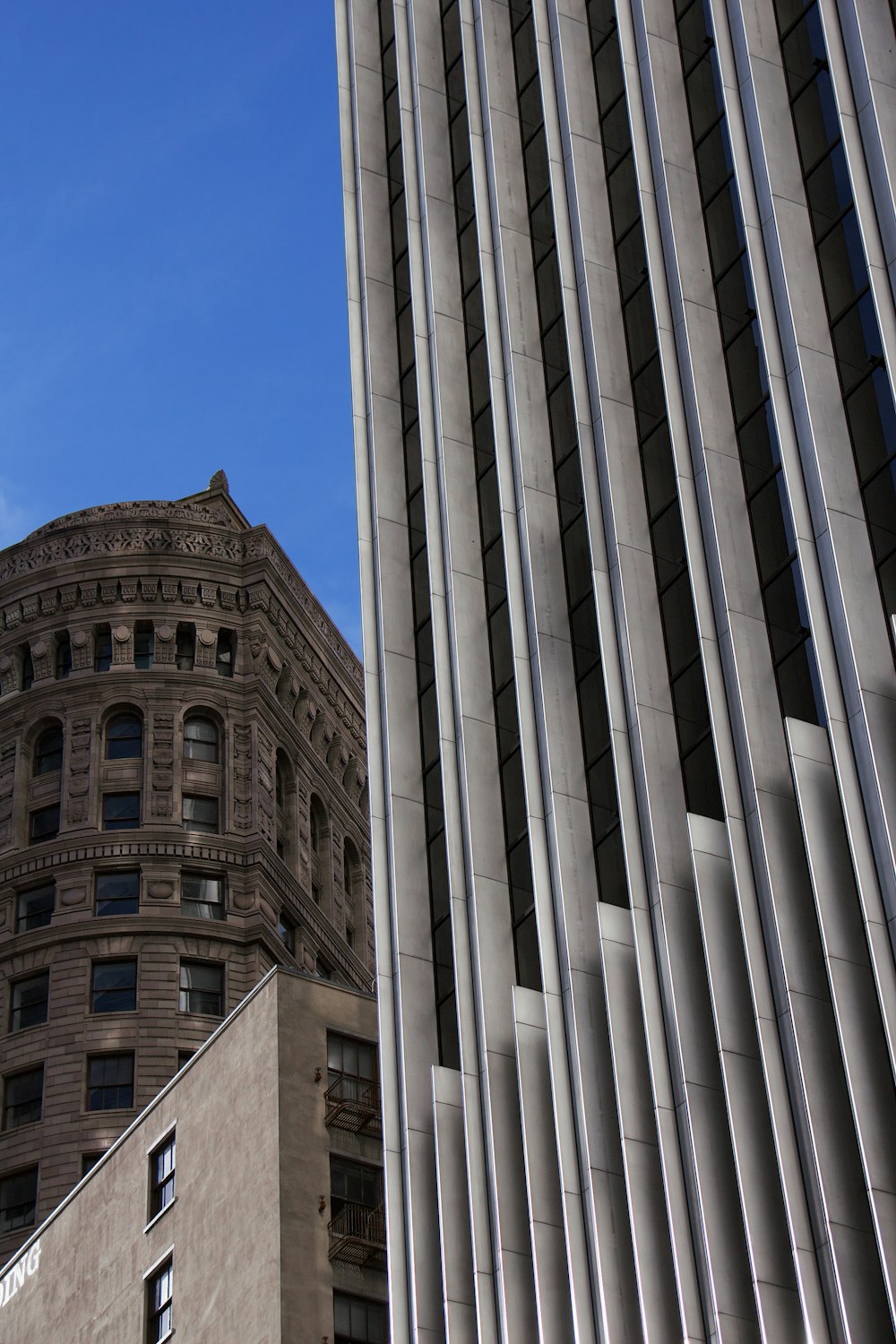 brown concrete building under blue sky during daytime