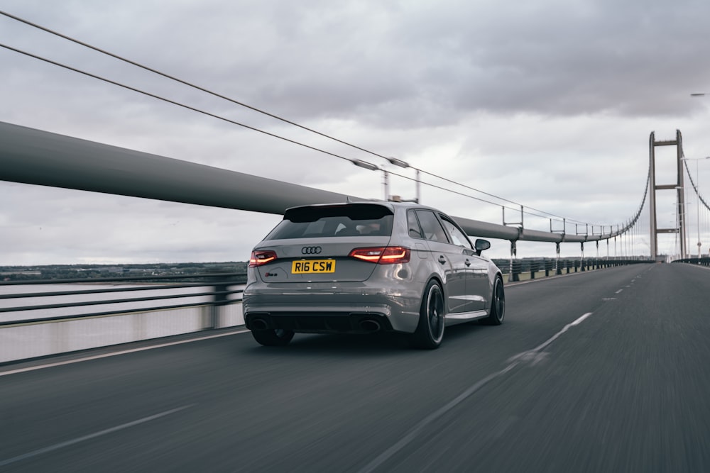 silver bmw m 3 on road