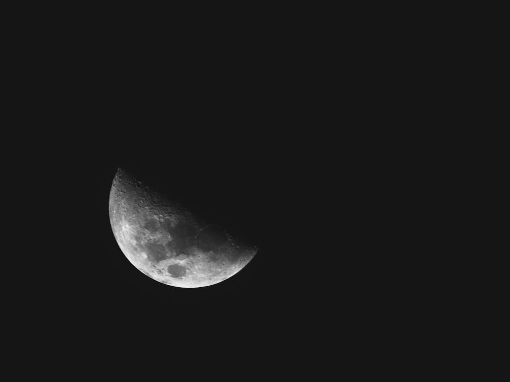 grayscale photo of moon during night time
